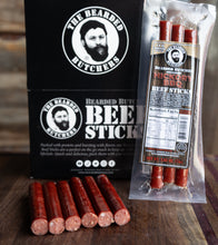 Load image into Gallery viewer, Bearded Butchers Hickory BBQ Beef Sticks packaging and sticks on a wooden surface
